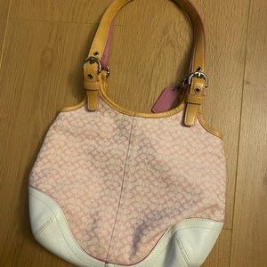 Pink, leather Coach handbag.